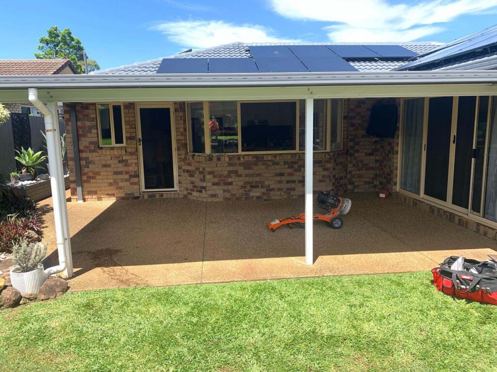 Pebblecrete patio before our work, looks dirty and old
