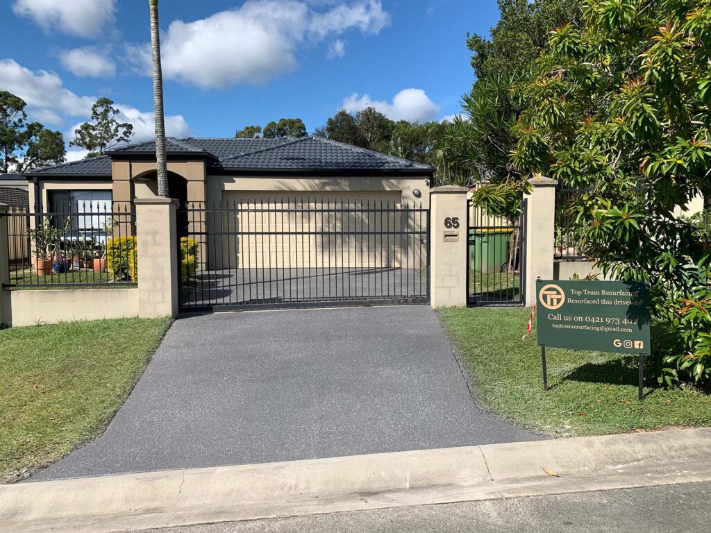 Driveway after resurfacing, dark grey,